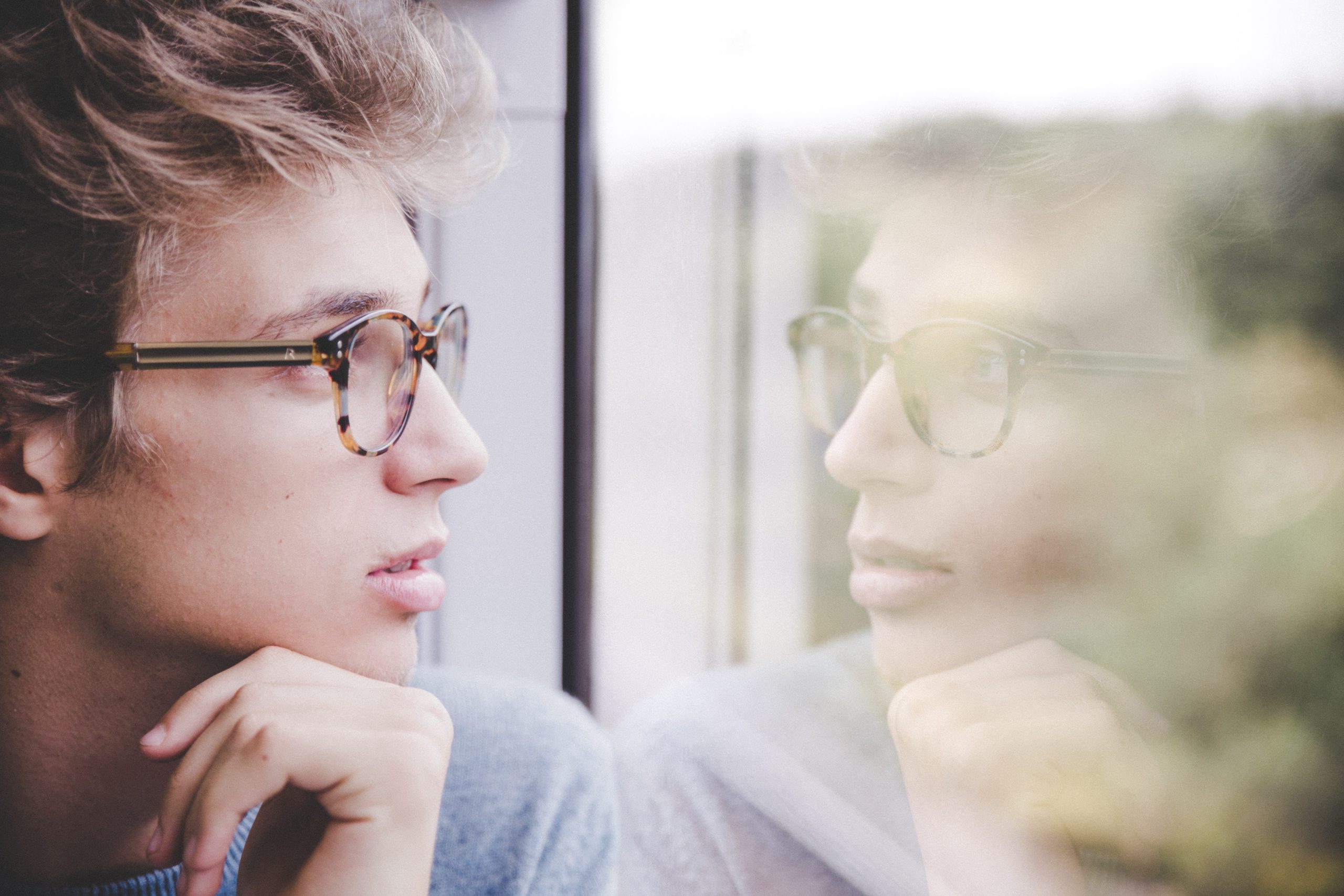 Person looking out train window
